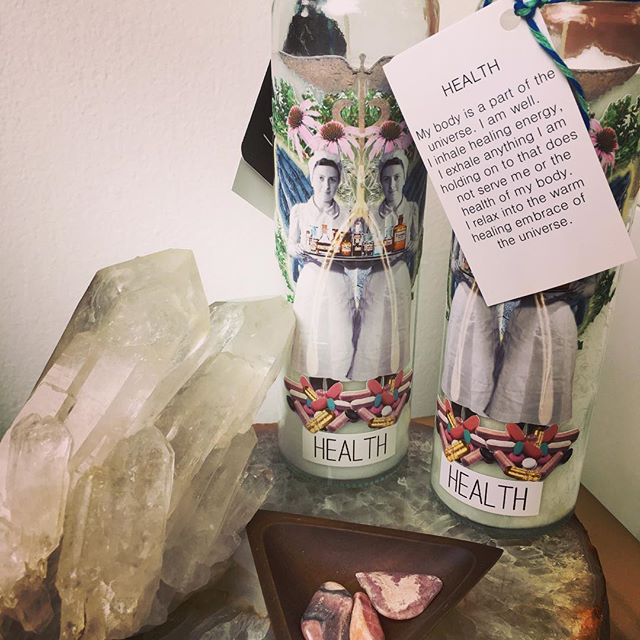 Hand-poured candles from Last Craft Designs on the studio shelf